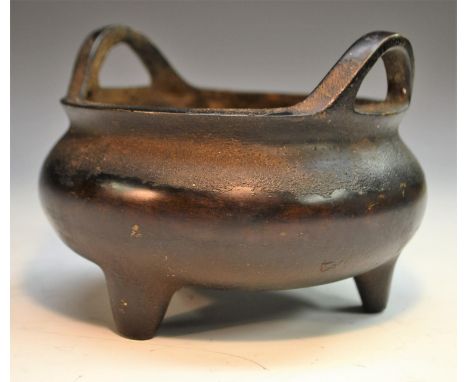 A Chinese bronze tripod ding censer, loop lug handles, 14cm diam, seal mark, 19th century