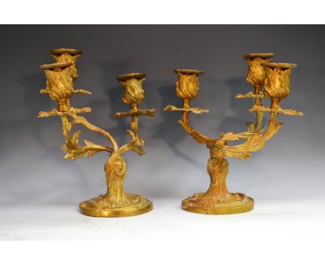 A pair of 19th century ormolu three-light candelabra, cast throughout with scrolling acanthus, 22.5cm high, c.1870
