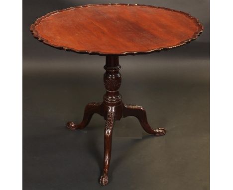 A George III mahogany tripod supper table, circular tilting top with pie-crust edge, turned urnular pillar and cabriole legs 