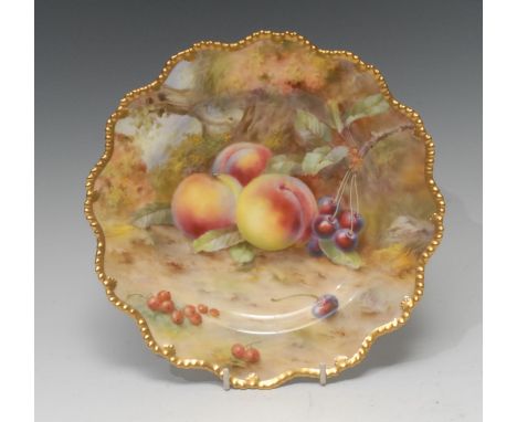 A Royal Worcester shaped circular  plate, painted by F Roberts, signed, with ripe peaches and cherries, on a mossy ground, gi