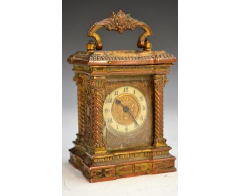 A 19th century Continental gilt metal miniature carriage clock, Arabic numerals, turned Corinthium colum to angles, shaped ba