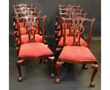 A set of eight Chippendale design mahogany dining chairs, comprising six side chairs and a pair of carvers, shaped and pierce
