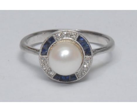 A sapphire diamond and culture pearl dress ring, central creamy white cultured pearl approx 6.5mm diameter, surrounded by and