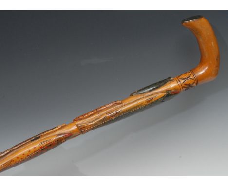 A 19th century Swedish Folk Art walking stick, carved with fish and eels coloured in polychrome, dated 1891, 77cm long