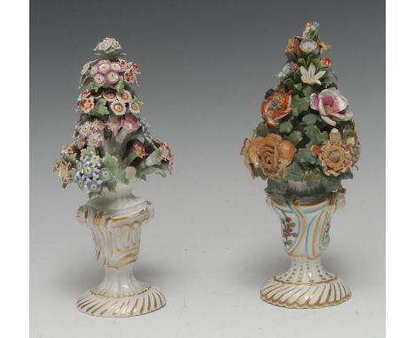 A Bow flower-encrusted rococo shaped vase, masks to sides, encrusted with issuing flowers, spiralled shaped base, 21cm high, 