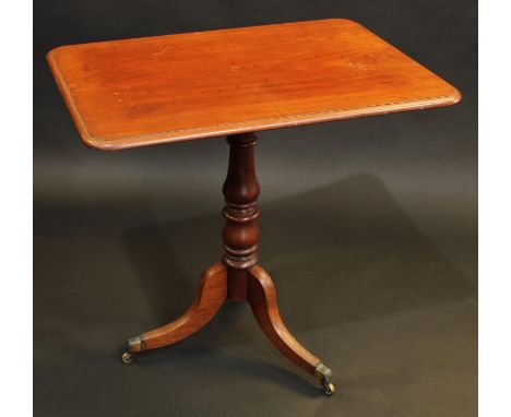 A 19th century mahogany tripod occasional table, rounded rectangular top, turned pillar, sabre legs, brass capped casters, 72