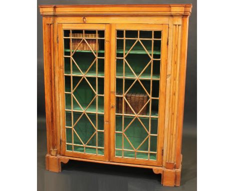 A George III pine display cabinet, astragal glazed doors flanked by reeded pilasters, later bracket feet, 160cm high, 135cm w