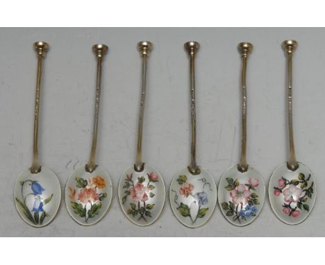 A set of six Elizabeth II silver-gilt and enamel seal top coffee spoons, each bowl decorated to verso with flowers, Birmingha