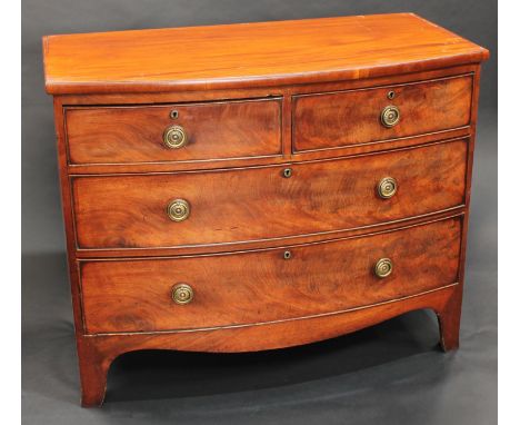 An early Victorian mahogany bow-fronted chest, of small proportions, slightly oversailing top above two short and two long gr