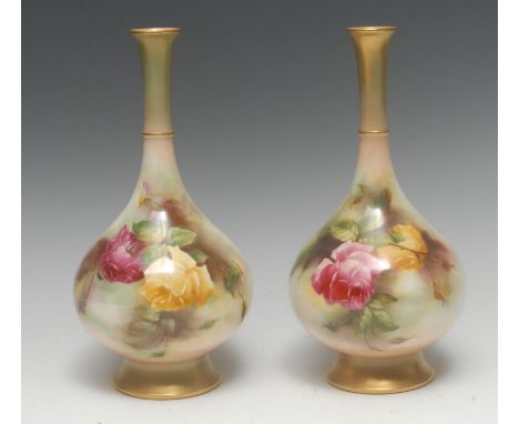 A pair of Royal Worcester James Hadley bottle vases, painted by M E Eaton, signed, with large red and yellow cabbage roses,  