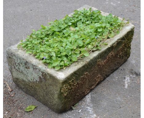 A 19th century Derbyshire gritstone  trough, 29cm high, 76cm wide, 43cm deep