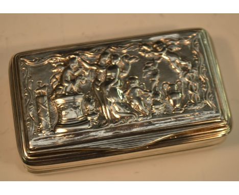 A George III silver waisted rounded rectangular snuff box, hinged cover cast with a Classical scene, reeded sides, gilt inter