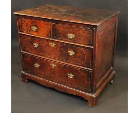 A Queen Anne oak chest, moulded top above two short and two long graduated drawers, incised with faux marquetry picked out in