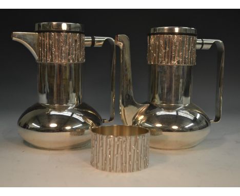 Brian Asquith (1930 - 2008) - an Elizabeth II silver three piece cafe au lait service, comprising coffee pot, hot milk ewer a
