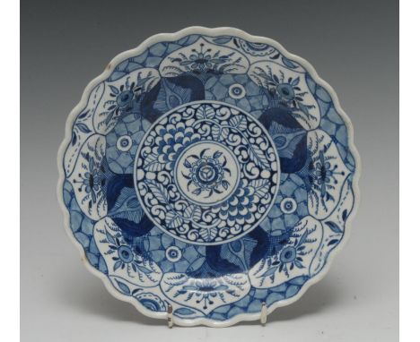 A Worcester Kang Hsi Lotus pattern shaped circular plate, 19.5cm diam, double concentric mark and  kite mark in blue, c.1770
