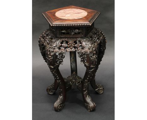 A 19th century Chinese hardwood pentagonal jardiniere stand, moulded beaded top with inset soapstone panel above a pierced fr