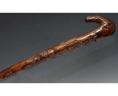 A 19th century Folk Art stick, carved with Vikings and Christian symbols, 95cm long