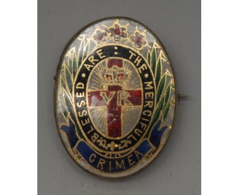 A 19th century Crimean Nurse Florence Nightingale Jewel - gilt metal and enamel, the  centre with the red cross of St George 