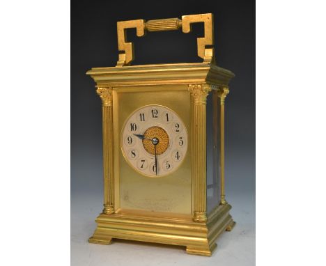 An early 20th century French gilt brass goliath carriage clock, 8cm silvered dial inscribed within dished reserves with Arabi