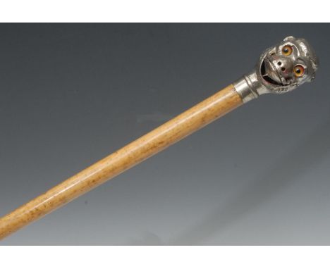A 19th century French novelty automaton walking cane, the white pommel as a monkey's head, with opening mouth and swivel eyes