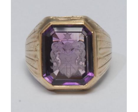 A 19th century amethyst armorial signet ring, with German or French arms, rectangular faceted amethyst measuring approx 17mm 