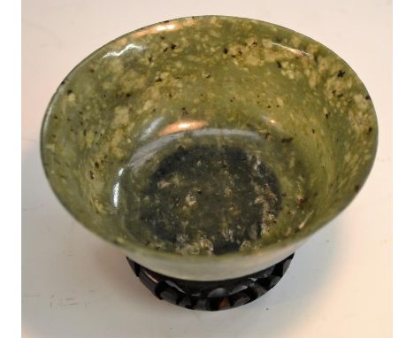A spinach jade bowl, 12cm diam, on  stand