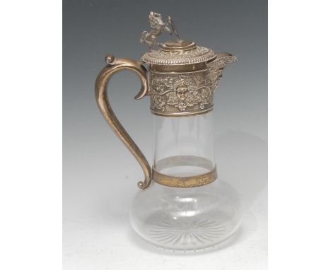 A Victorian silver and clear glass claret jug, star cut base, deep collar embossed with Bacchus mask and scrolling fruiting v