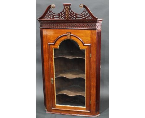 A George II design parcel-gilt mahogany wall hanging corner vitrine, pierced swan neck pediment in the Gothic Chippendale tas