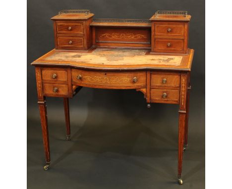 A Sheraton Revival satinwood crossbanded mahogany and marquetry writing desk, inverted breakcentre superstructure with brass 