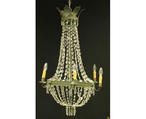 An early 20th century French painted tin tolework six light electrolier, with swags of prismatic drops and facetted pendants,