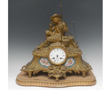 A 19th century French gilt metal mantel clock, with Roman numerals, twin winding holes, Sevres penels, the case surmoutned wi