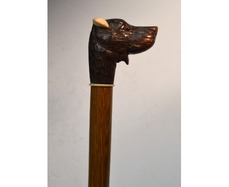 A Black Forest novelty automaton walking stick, the handle carved as the head of a dog, his mouth movable, painted tongue, gl