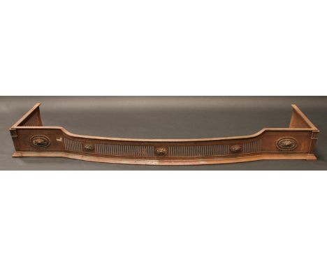 An Adam Revival steel Country House bow fronted fire fender, pierced and applied with oval acanthus patera, outlined with bea