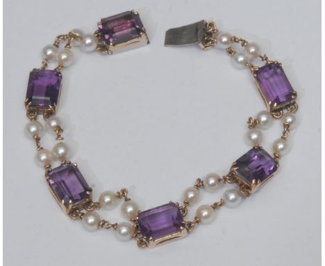 An amethyst and cultured pearl bracelet, six rectangular cushion cut vibrant purple amethysts, each divided by quartet of cul
