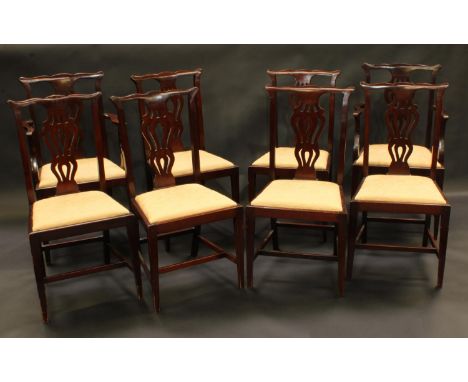 A set of eight Chippendale Revival mahogany dining chairs, comprising six side chairs and a pair of carvers, cupid's bow cres