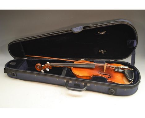 A 19th century German violin, the two-piece back 36cm long excluding button, marked DT, paper label Antonius Stradivarius Cre