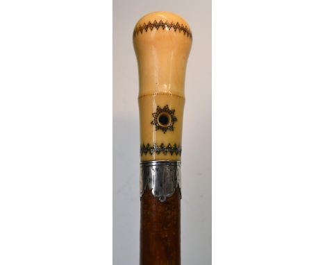 A Queen Anne silver piqué, ivory and malacca gentleman's walking stick, the bulbous handle typically inlaid with radiating ge