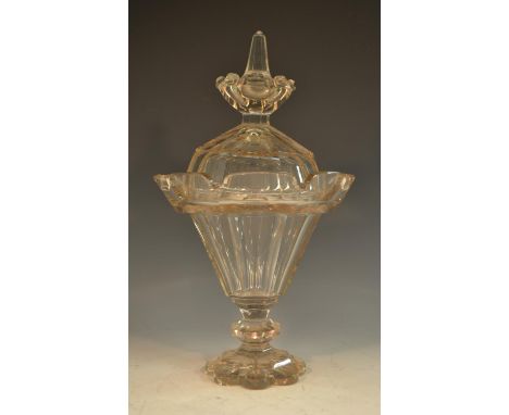 A 19th century glass lantern-shaped pedestal sweetmeat vase and cover, slightly tapering, panelled throughout, outswept crene