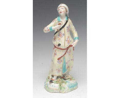 A Derby Patch Mark figure, Abyssinian Archer, he stands holding arrows, wearing a light yellow robe with flowers, 29cm high, 