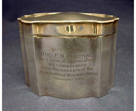 A 20th century silver Tea Caddy, shaped oval form with hinged lid, inscribed with a presentation dedication, Birmingham 1931,