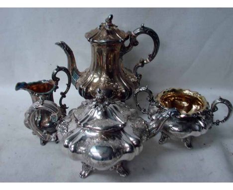 An early Victorian silver four-piece Tea Service of Rococo style, tea and coffee pots with cast acorn knop to hinged cover, g