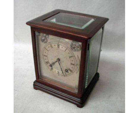 A Mahogany table clock, early 19th century with bevelled glass, silvered dial with strike silent and ting-tang striking movem