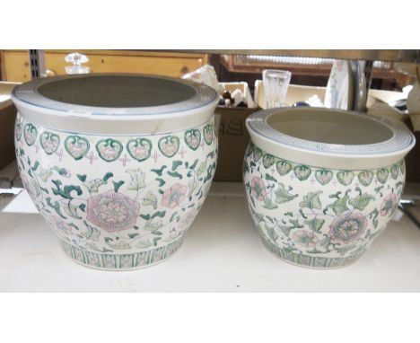 A large Chinese ceramic jardiniere/planter decorated with floral pattern and another smaller example (2)

Property of Dunkirk