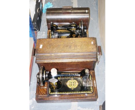A collection of four assorted Singer sewing machines, including: model no. Y9304850, V1308328, the next with manual, F621256 