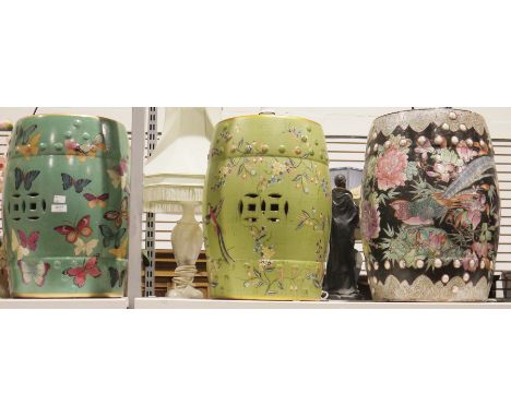Three ceramic Chinese style garden barrel seats, one decorated with butterflies another with birds and flowers and the last w