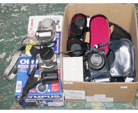 Assorted cameras and camera accessories, including: a boxed Olympus C-2100 ultra zoom digial camera, a Canon Powershot G6, ca