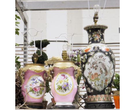 A small quantity of vases/jars converted into lamps to include a black ground Japanese style lamp bearing birds and floral sc