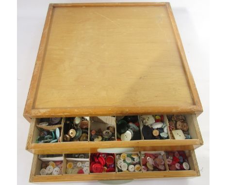 Mid-century haberdasher's two-drawer table-top button cabinet, each drawer full of assorted coloured plastic, gilt-metal, gla