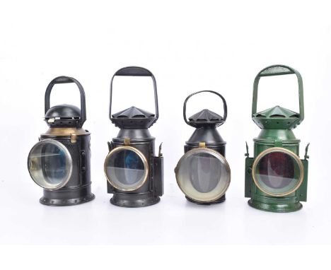 Four Repainted/Restored Railway Lamps, all of cylindrical form, with loop handles, three black painted, GWR dated 1935 with b