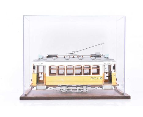 A large-scale kit-built non-powered Lisbon Tram Model, of plywood construction with some moulded plastic or metal parts, whee